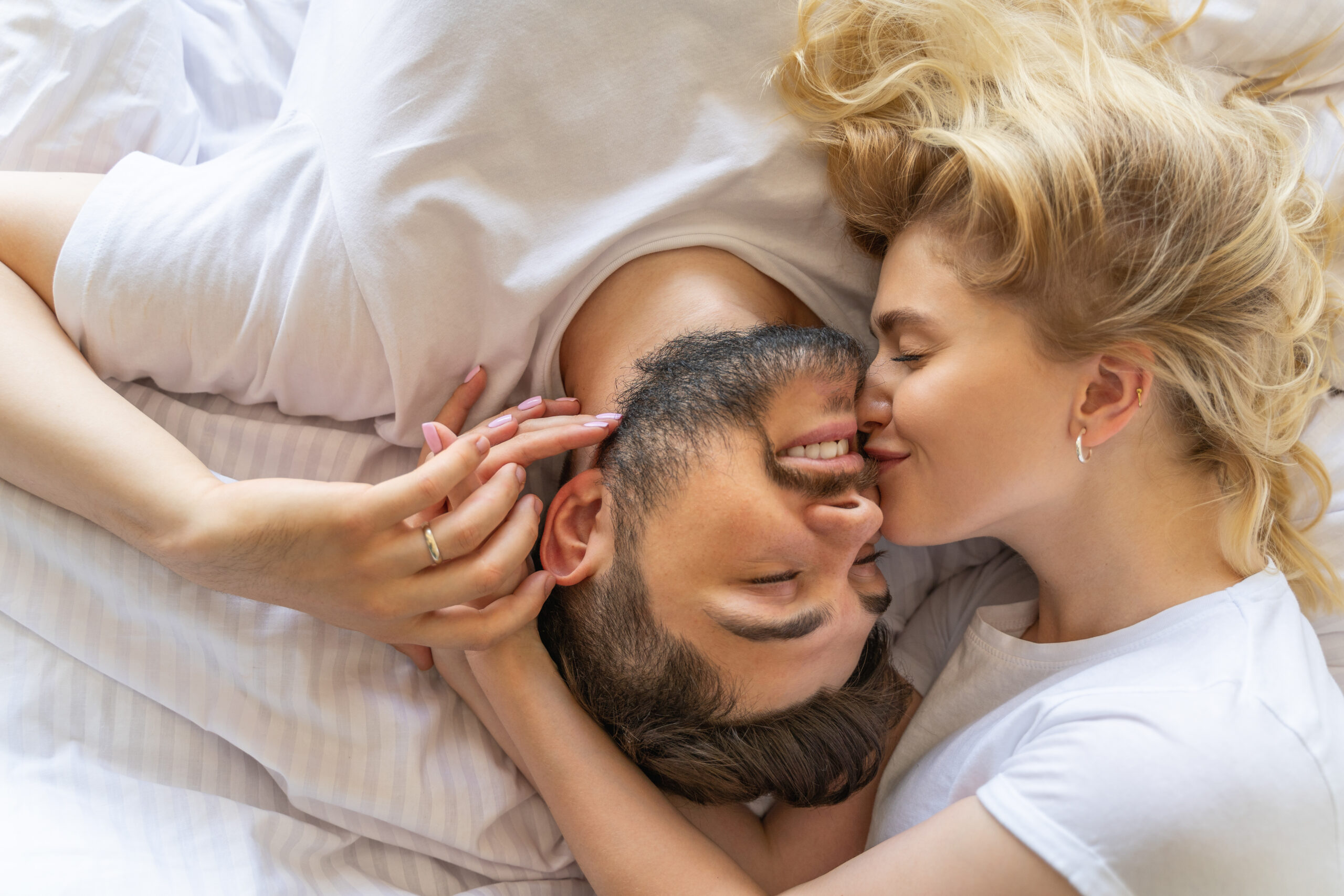 Couple cudding on bed