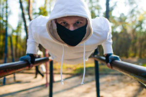Man working out on bar in the park