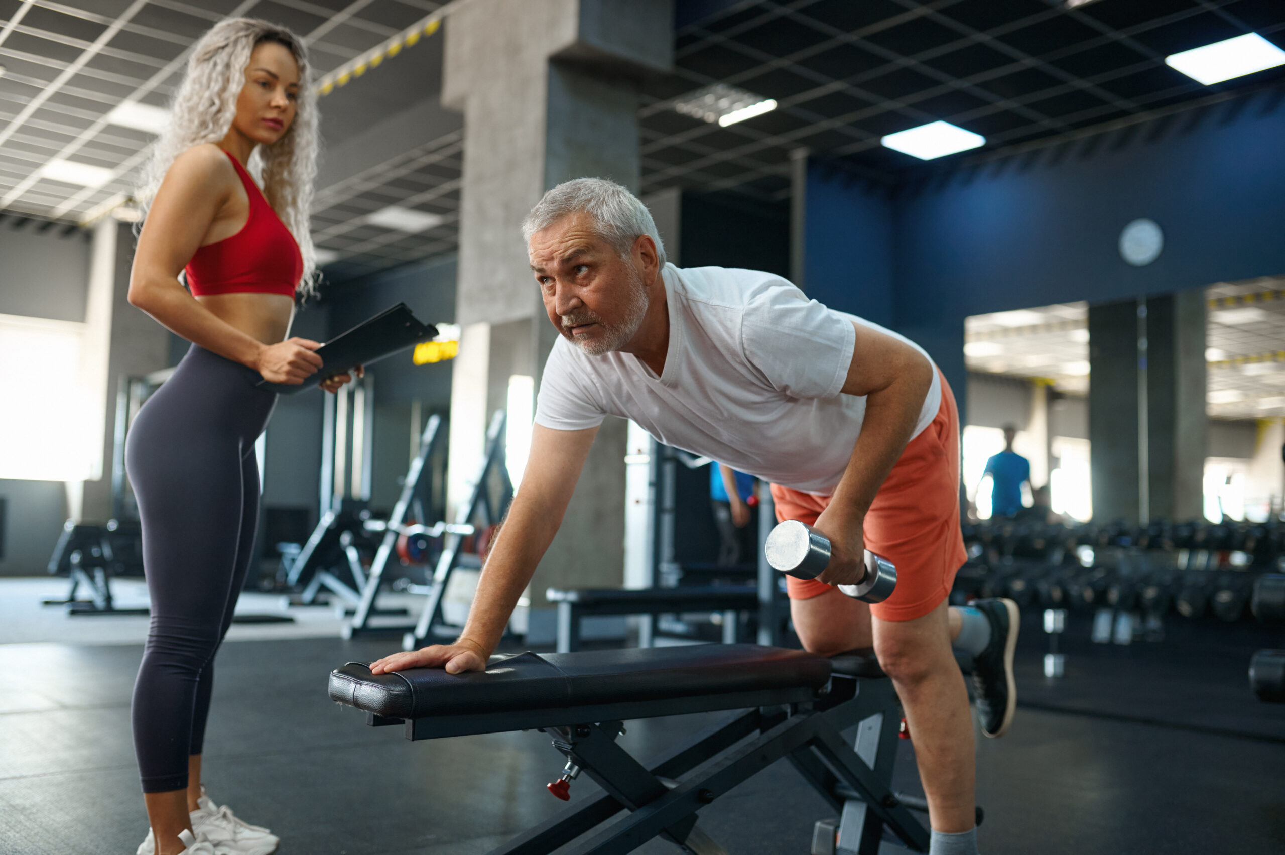 Man working with woman watching on