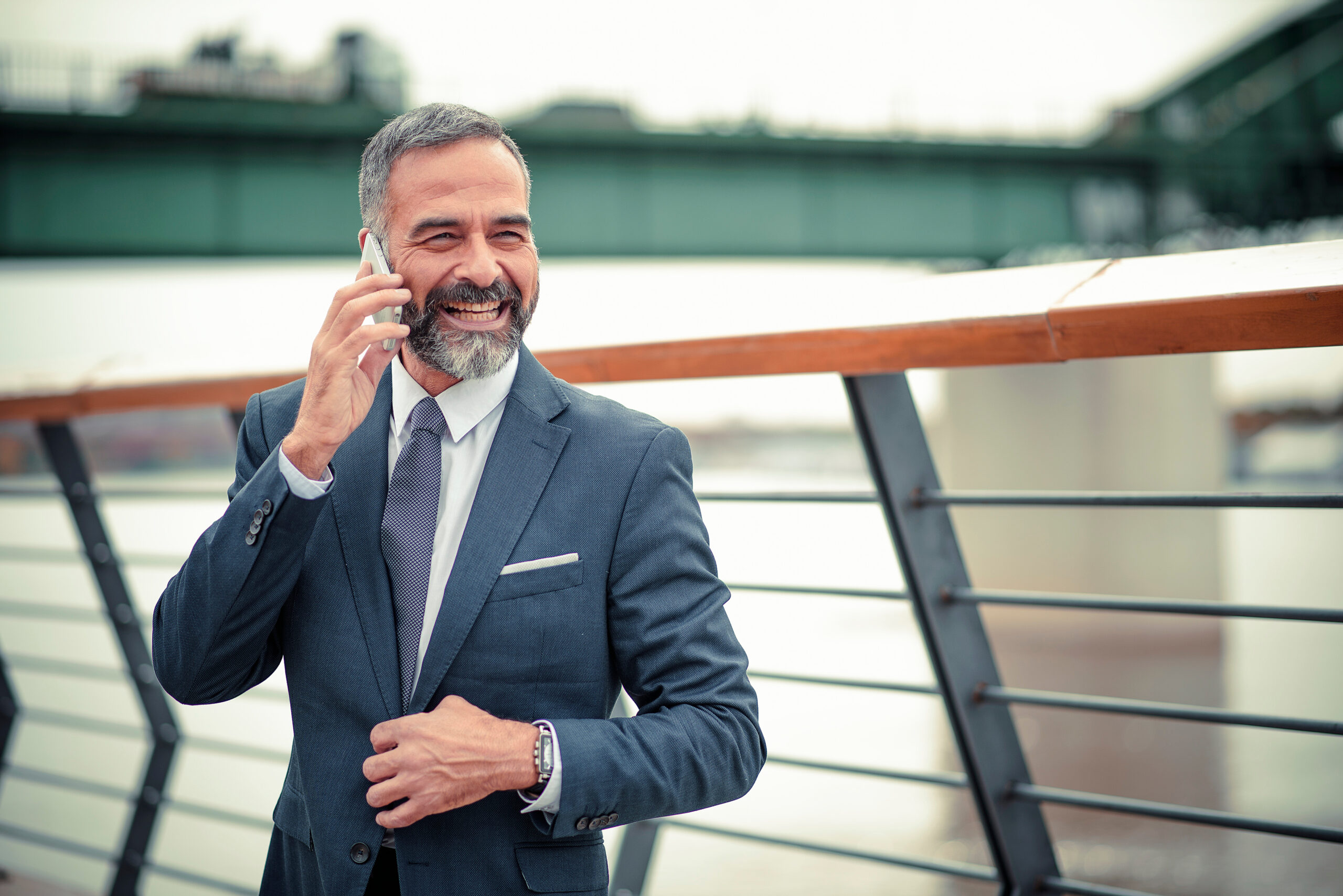 Man on the phone by river